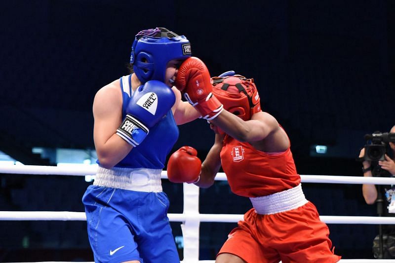 Dubois of England in Red lands a punch against Asatrian of Russia (Image Courtesy: AIBA)